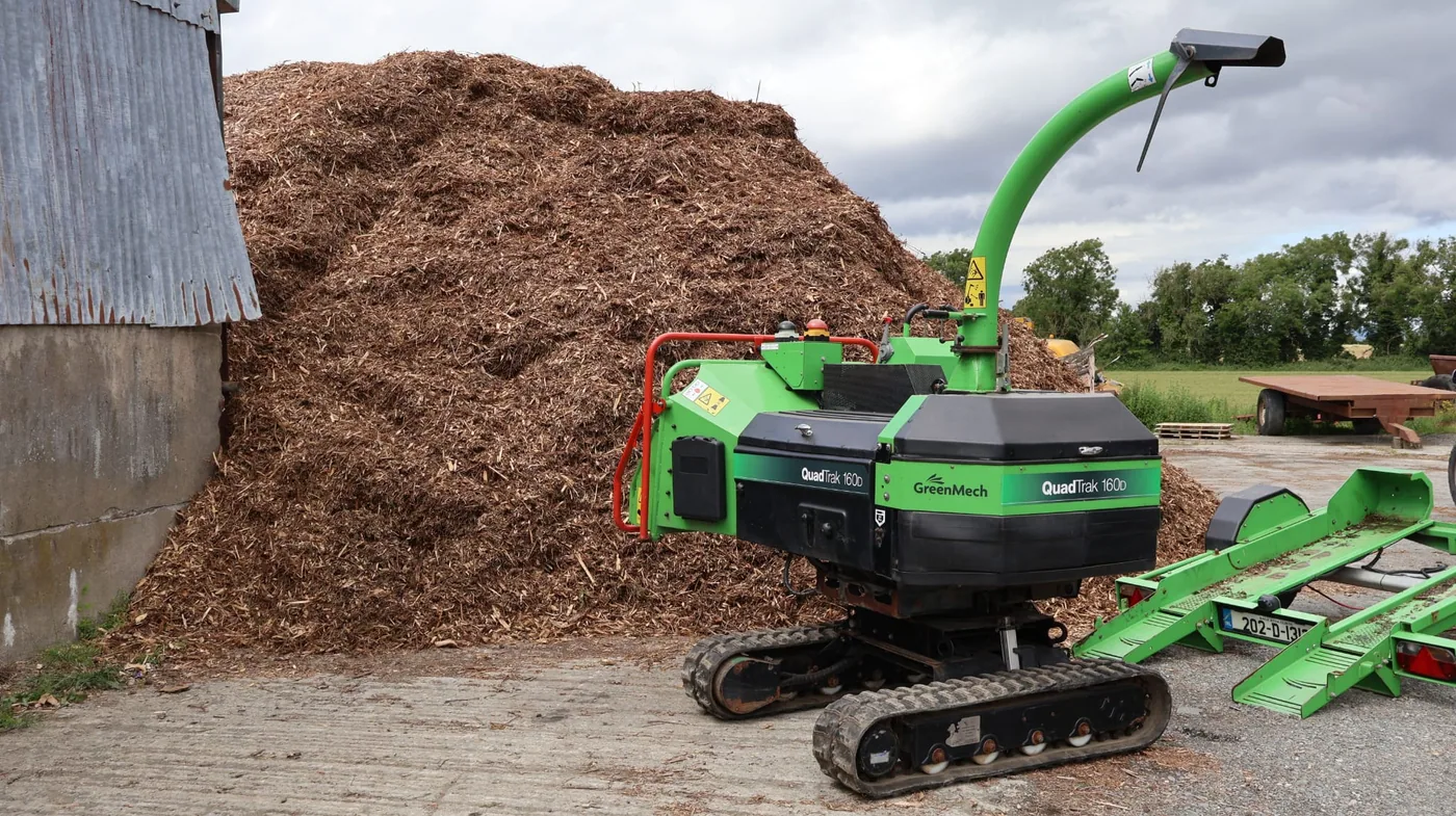 Large stock of wood chip and mulch beside tracked chipping equipment — enquiries from Ardee